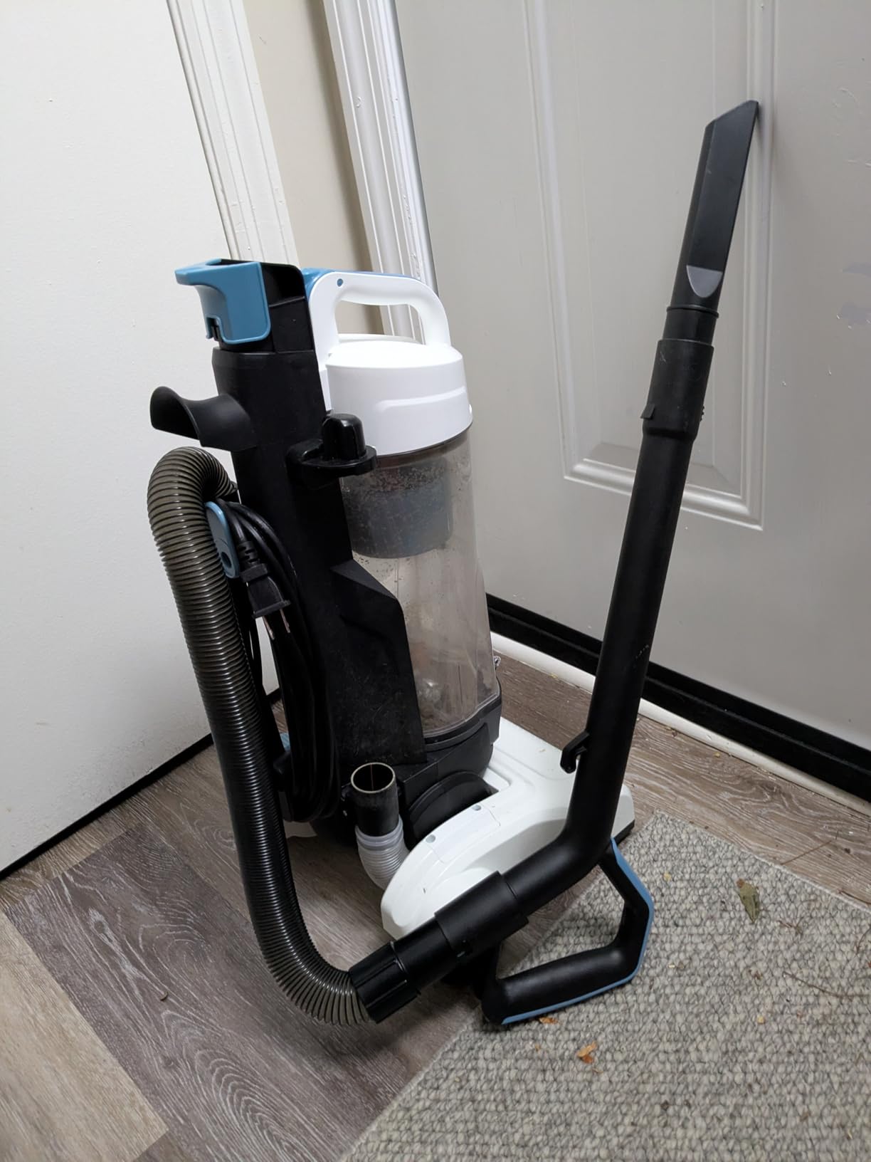 Amazon Basics Upright Bagless Vacuum Cleaner for Carpet and Hard Floors, With Crevice and Upholstery Tools, Detachable Handle, Lightweight (8.4 lbs), 1.7L Dust Cup, 720W, 25ft Cord, Black/White Customer Review Amazon Basics Upright Bagless Vacuum Cleaner for Carpet and Hard Floors, With Crevice and Upholstery Tools, Detachable Handle, Lightweight (8.4 lbs), 1.7L Dust Cup, 720W, 25ft Cord, Black/White - Customer Photo 1