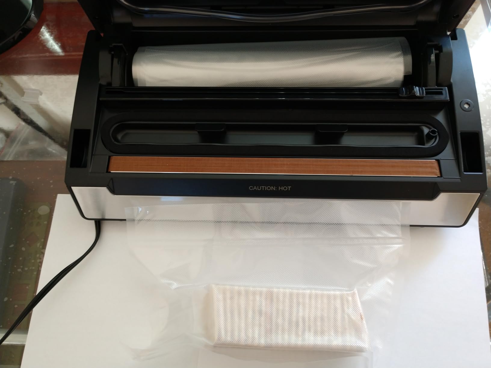 Avid Armor Vacuum Sealer Machine AVS2400, Professional Food Sealer with Roll Storage & Built-In Cutter, Compact Vacuum Sealer for Food Preservation Customer Review Avid Armor Vacuum Sealer Machine AVS2400, Professional Food Sealer with Roll Storage & Built-In Cutter, Compact Vacuum Sealer for Food Preservation - Customer Photo 1