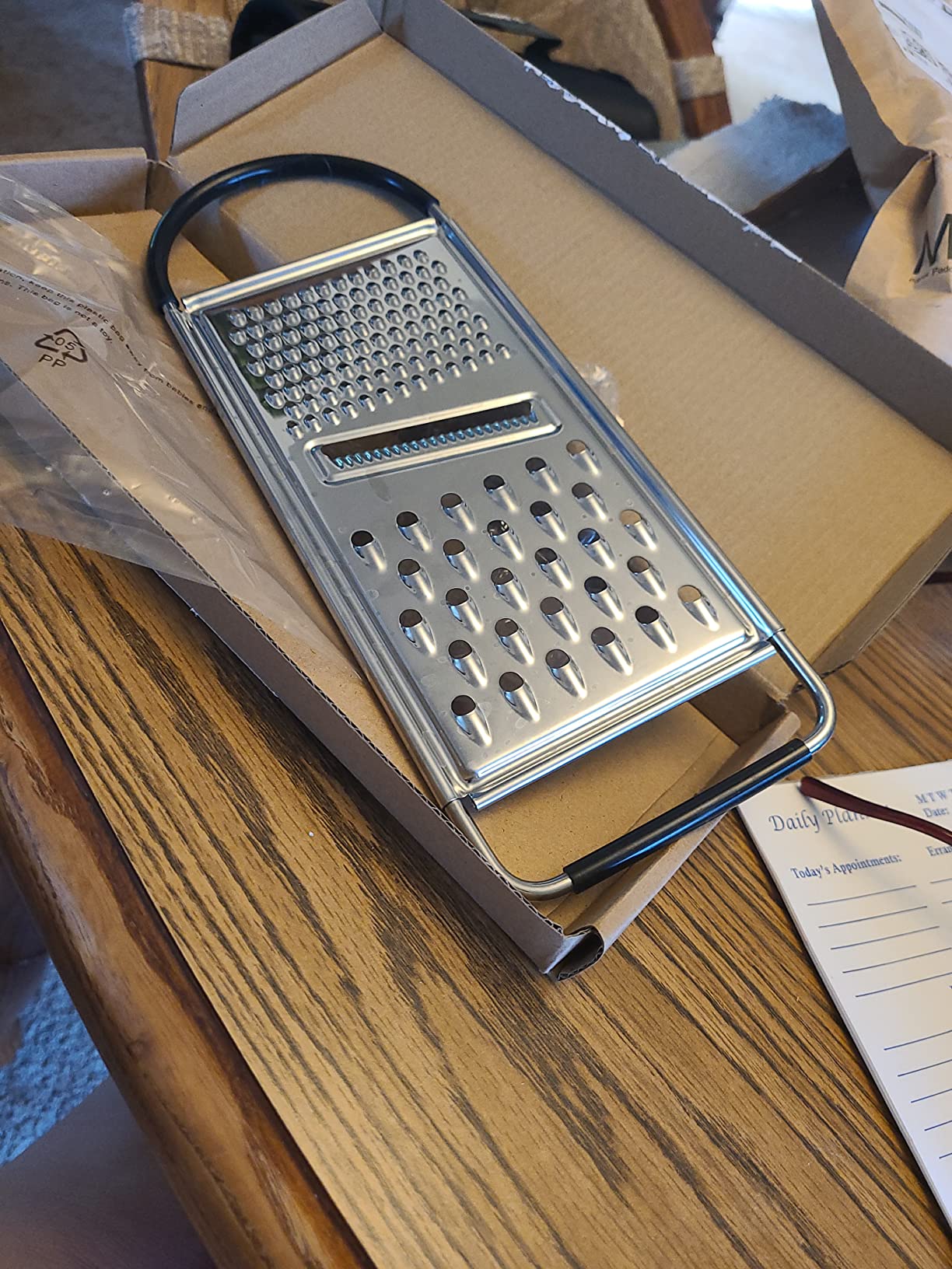 Amazon Basics Cheese Grater with Handle, Stainless Steel Zester, Rectangular, Non-Slip, Multifunction Tool for Kitchen Prep, Black Customer Review Amazon Basics Cheese Grater with Handle, Stainless Steel Zester, Rectangular, Non-Slip, Multifunction Tool for Kitchen Prep, Black - Customer Photo 2
