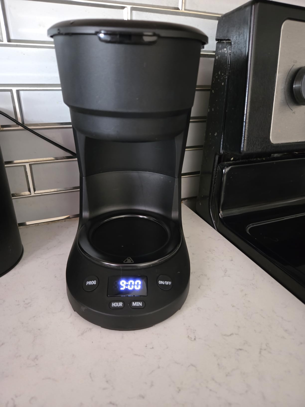 5-Cup Programmable Drip Coffee Maker, a compact coffee machine with a digital clock and 24-hour programmable timer, featuring Auto Shut-Off, and a Removable Filter Basket for Home & Office. Customer Review 5-Cup Programmable Drip Coffee Maker, a compact coffee machine with a digital clock and 24-hour programmable timer, featuring Auto Shut-Off, and a Removable Filter Basket for Home & Office. - Customer Photo 1