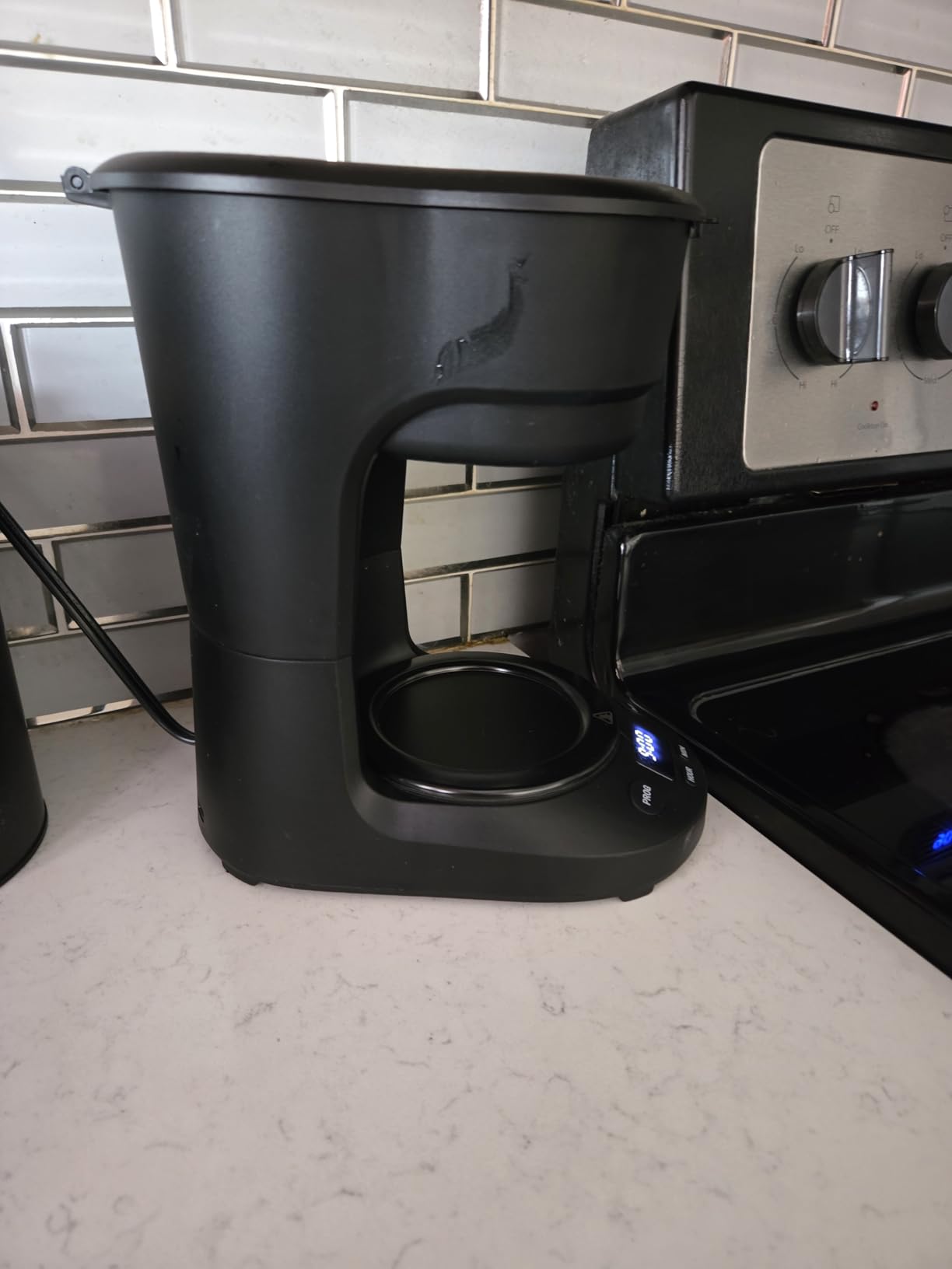 5-Cup Programmable Drip Coffee Maker, a compact coffee machine with a digital clock and 24-hour programmable timer, featuring Auto Shut-Off, and a Removable Filter Basket for Home & Office. Customer Review 5-Cup Programmable Drip Coffee Maker, a compact coffee machine with a digital clock and 24-hour programmable timer, featuring Auto Shut-Off, and a Removable Filter Basket for Home & Office. - Customer Photo 2