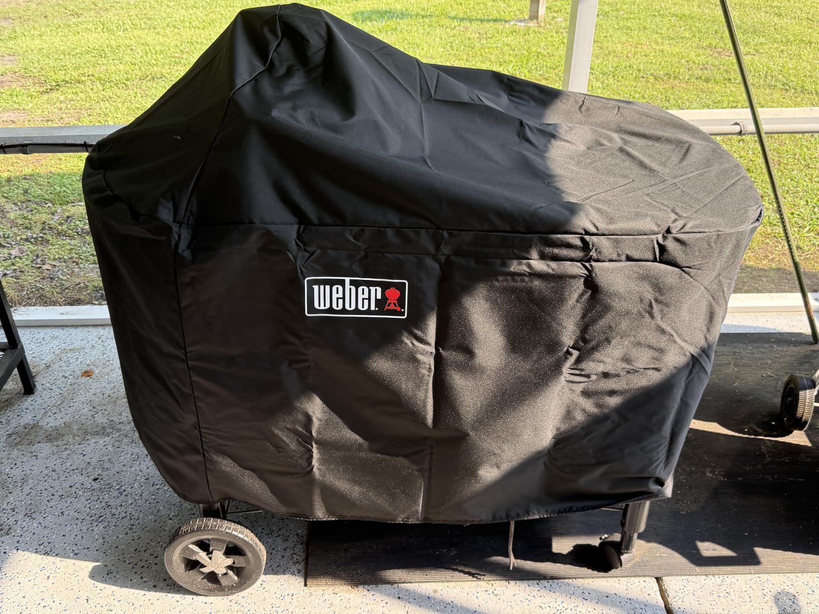 Weber Premium 22-Inch Charcoal Grill Cover, Black - UV-Resistant, Breathable & Water-Resistant Polyester, Secure Strap Fit, Fits 22