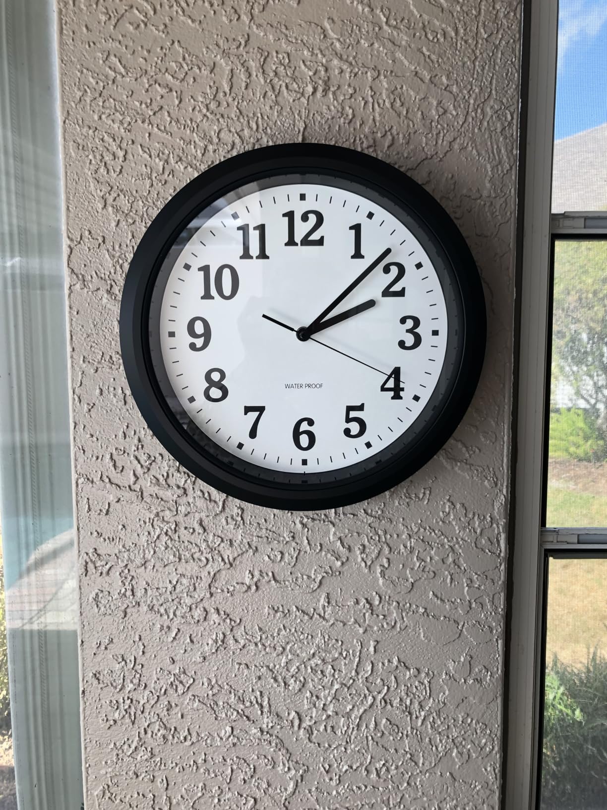 Caysie 12 Inch Sealed Indoor Outdoor Waterproof Wall Clock, Durable Silent Non-Ticking Battery Operated Quality Quartz Round Clock, Wall Decorative for Patio, Pool, Bathroom (Black) customer photo 1