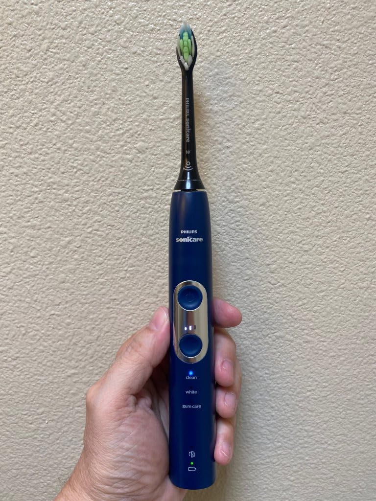 Philips Sonicare ProtectiveClean 6100 Rechargeable Electric Toothbrush, with Pressure Sensor, 3 Cleaning Modes, SmarTimer and QuadPacer, 14-Day Battery Life, Travel Case, White, Model HX6877/21 customer photo 1