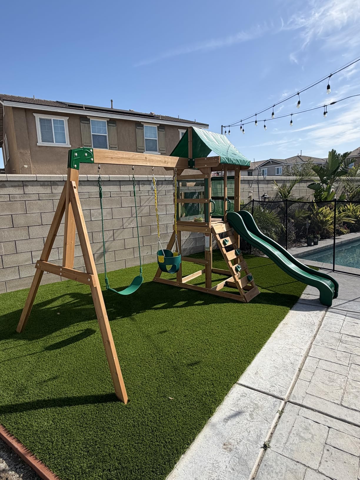 Backyard Discovery Buckley Hill Cedar Wood Swing Set with Wave Slide, Play Deck, Rock Wall Ladder, Belt Swings, Chalkboard, Canopy Roof, Outdoor Playset customer photo 1