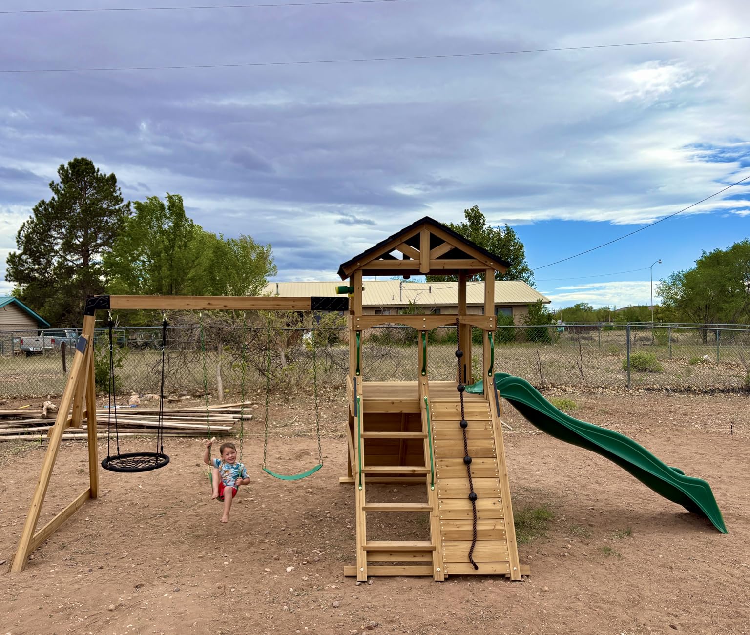 Backyard Discovery Endeavor II Cedar Wood Swing Set with Wave Slide, Play Deck, Double Rock Wall, Picnic Table, Climbing Wall, Belt Swings, Web Swing, Toy Telescope, Step Ladder, Outdoor Playset customer photo 1