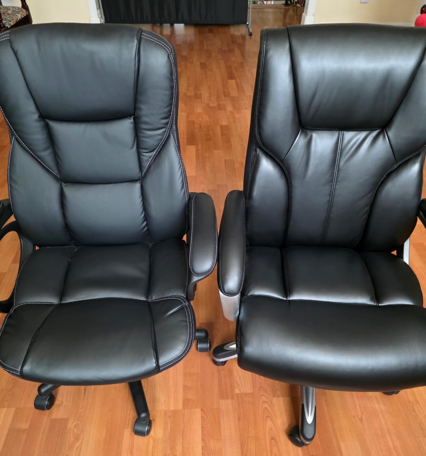 Amazon Basics Executive High Back Office Chair Adjustable Height Tilt Swivel Padded Seat Bonded Leather Wheels Black/Silver customer photo 1