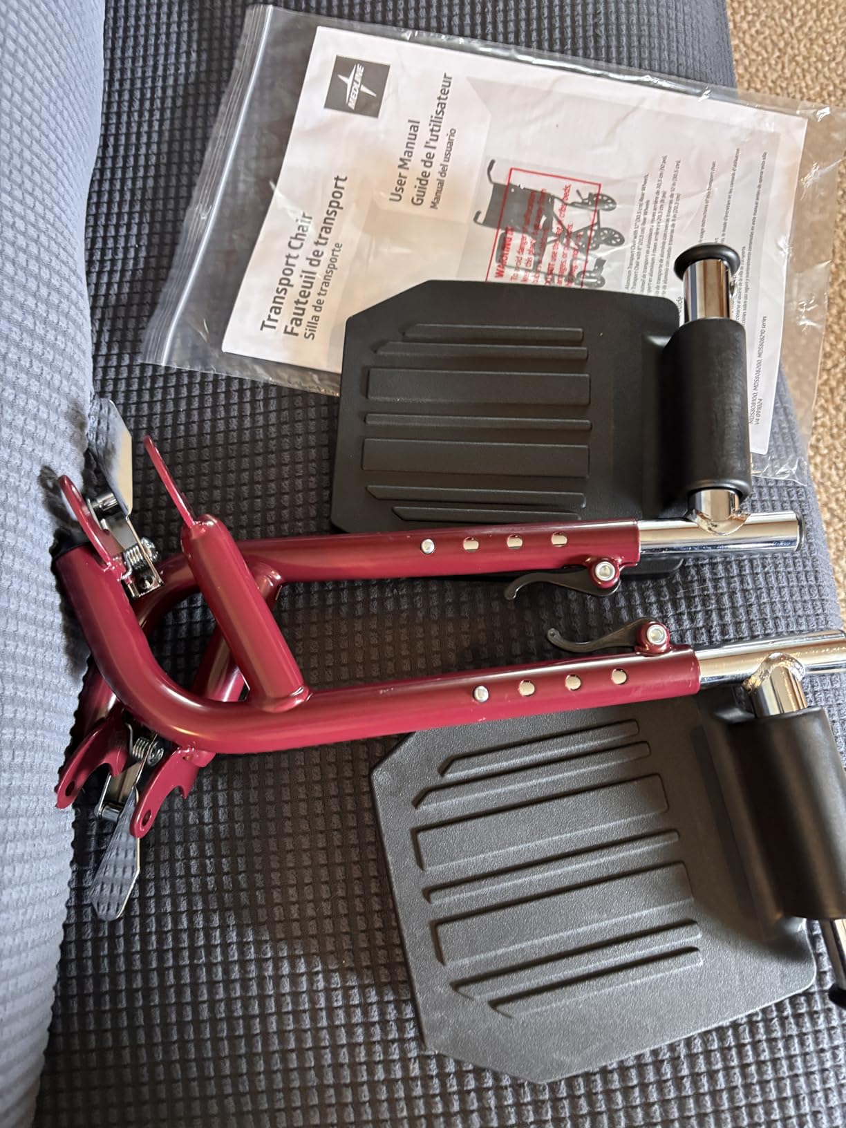 Medline Lightweight Foldable Transport Wheelchair with Handbrakes and 12-Inch Wheels, Red Frame, Black Upholstery customer photo 2