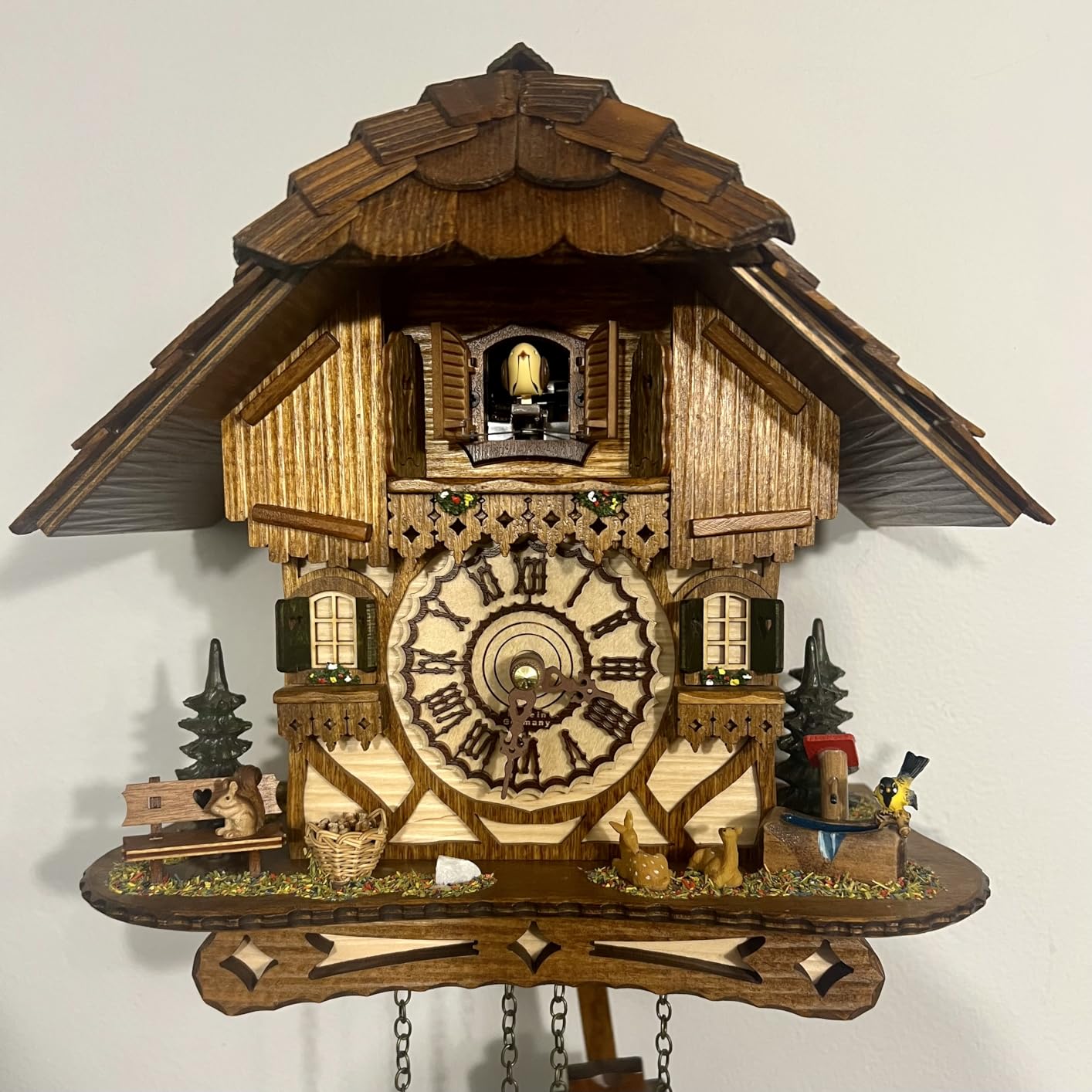 Cuckoo Palace German Cuckoo Clock - Black Forest Hillside Chalet with Animal Figures - Quartz Movement with Music - Night Silence Sensor - 10.6 Inch Wall Clock customer photo 1