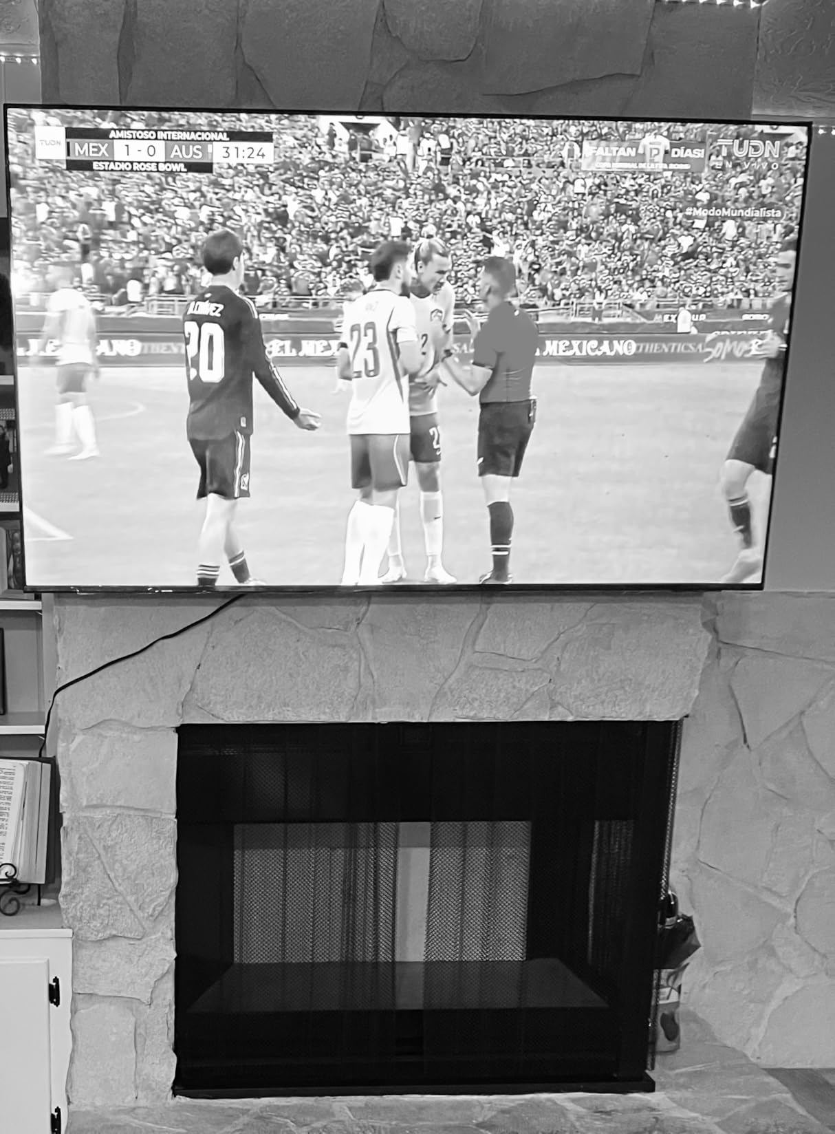 Amazon Basics Low Profile TV Wall Mount with Horizontal Post Installation Leveling for 37 to 86 inch TVs, Wood Studs Compatible, Black customer photo 1