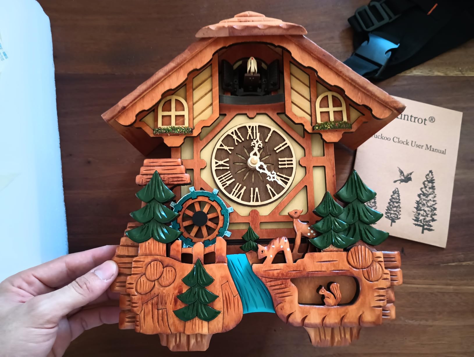 Kintrot Cuckoo Clock, Handcrafted Traditional Black Forest Chalet Style Wooden Wall Clock with Singing Bird, Rotating Waterwheel, and 12 Melodies customer photo 2
